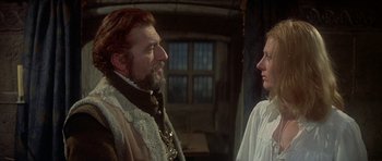 Movie still from “Mary, Queen of Scots” (1971), directed by Charles Jarrott – A man and a woman are standing next to each other; Medium shot, Over the shoulder angle