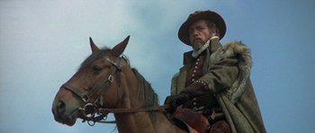 Movie still from “Mary, Queen of Scots” (1971), directed by Charles Jarrott – A man sitting on top of a brown horse; Medium shot, Low angle