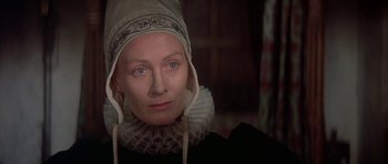 Movie still from “Mary, Queen of Scots” (1971), directed by Charles Jarrott – A person wearing a headdress; Close Up shot, Over the shoulder angle