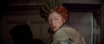 Movie still from “Mary, Queen of Scots” (1971), directed by Charles Jarrott – A person wearing a hat; Close Up shot, Over the shoulder angle