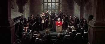 Movie still from “Mary, Queen of Scots” (1971), directed by Charles Jarrott – A group of people sitting in front of a crowd; Wide shot, High angle