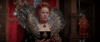 Movie still from “Mary, Queen of Scots” (1971), directed by Charles Jarrott – A person holding a cell phone; Close Up shot, Low angle