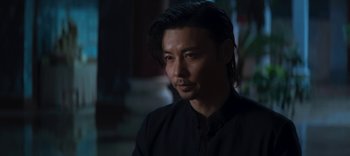 Movie still from “Master Z: The Ip Man Legacy” (2018), directed by Woo-Ping Yuen – A person wearing a black shirt; Close Up shot, Over the shoulder angle