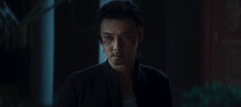 Movie still from “Master Z: The Ip Man Legacy” (2018), directed by Woo-Ping Yuen – A person with long hair; Close Up shot, Low angle