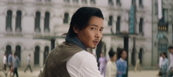 Movie still from “Master Z: The Ip Man Legacy” (2018), directed by Woo-Ping Yuen – A person with long black hair; Close Up shot, Over the shoulder angle