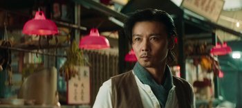 Movie still from “Master Z: The Ip Man Legacy” (2018), directed by Woo-Ping Yuen – A person with long black hair; Close Up shot, Low angle
