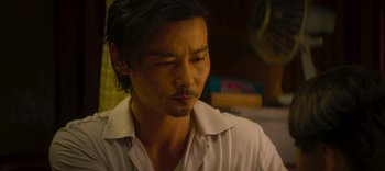 Movie still from “Master Z: The Ip Man Legacy” (2018), directed by Woo-Ping Yuen – A person wearing a white shirt; Close Up shot, Low angle