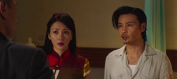 Movie still from “Master Z: The Ip Man Legacy” (2018), directed by Woo-Ping Yuen – A man and a woman standing next to each other; Close Up shot, Over the shoulder angle