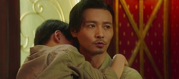 Movie still from “Master Z: The Ip Man Legacy” (2018), directed by Woo-Ping Yuen – A person wearing a shirt; Close Up shot, Low angle