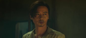 Movie still from “Master Z: The Ip Man Legacy” (2018), directed by Woo-Ping Yuen – A person wearing a white shirt; Close Up shot, Low angle