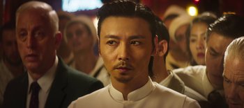 Movie still from “Master Z: The Ip Man Legacy” (2018), directed by Woo-Ping Yuen – A person wearing a white shirt; Close Up shot, Low angle