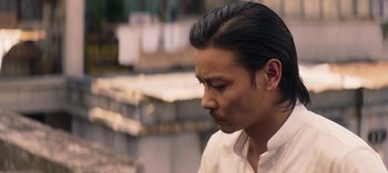 Movie still from “Master Z: The Ip Man Legacy” (2018), directed by Woo-Ping Yuen – A person wearing a white shirt; Close Up shot, Low angle