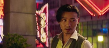 Movie still from “Master Z: The Ip Man Legacy” (2018), directed by Woo-Ping Yuen – A person wearing a vest; Close Up shot, Low angle