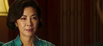 Movie still from “Master Z: The Ip Man Legacy” (2018), directed by Woo-Ping Yuen – A person wearing a blue shirt; Close Up shot, Over the shoulder angle