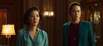 Movie still from “Master Z: The Ip Man Legacy” (2018), directed by Woo-Ping Yuen – Two women standing next to each other in front of a wall; Medium shot, Over the shoulder angle