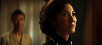 Movie still from “Master Z: The Ip Man Legacy” (2018), directed by Woo-Ping Yuen – A person wearing a necklace; Close Up shot, Low angle