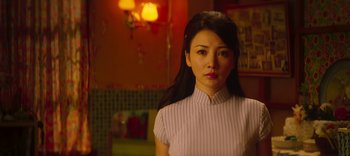 Movie still from “Master Z: The Ip Man Legacy” (2018), directed by Woo-Ping Yuen – A woman with long black hair standing in a room; Close Up shot, Low angle