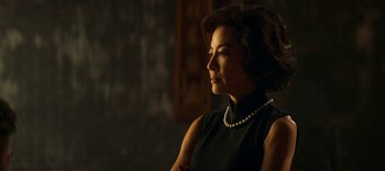 Movie still from “Master Z: The Ip Man Legacy” (2018), directed by Woo-Ping Yuen – A woman wearing a black dress and a pearl necklace; Close Up shot, Low angle