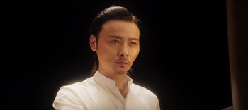 Movie still from “Master Z: The Ip Man Legacy” (2018), directed by Woo-Ping Yuen – A person wearing a white shirt; Close Up shot, Low angle