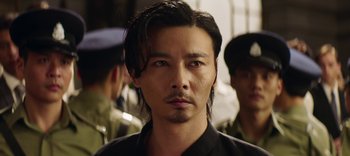 Movie still from “Master Z: The Ip Man Legacy” (2018), directed by Woo-Ping Yuen – A person wearing a black shirt; Close Up shot, Low angle
