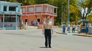 Movie still from “Masterminds” (2015), directed by Jared Hess – A man standing in the middle of the street; Wide shot, Low angle