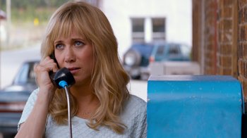Movie still from “Masterminds” (2015), directed by Jared Hess – A woman talking on a phone while standing next to a parking meter; Close Up shot, Over the shoulder angle