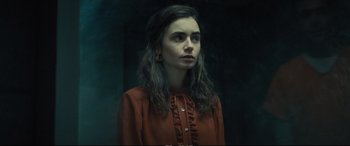 Movie still from “Extremely Wicked, Shockingly Evil and Vile” (2019), directed by Joe Berlinger – A woman with long hair wearing a red shirt; Close Up shot, Low angle