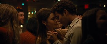 Movie still from “Extremely Wicked, Shockingly Evil and Vile” (2019), directed by Joe Berlinger – A man and a woman are kissing in a room; Close Up shot, Low angle