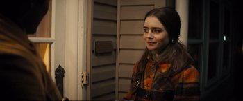 Movie still from “Extremely Wicked, Shockingly Evil and Vile” (2019), directed by Joe Berlinger – A woman standing in front of a door; Close Up shot, Over the shoulder angle