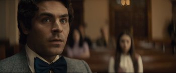 Movie still from “Extremely Wicked, Shockingly Evil and Vile” (2019), directed by Joe Berlinger – A person wearing a bow tie; Close Up shot, Over the shoulder angle