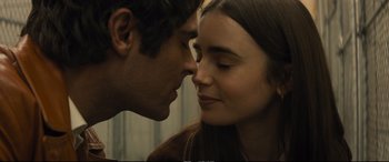 Movie still from “Extremely Wicked, Shockingly Evil and Vile” (2019), directed by Joe Berlinger – A man and a woman face to face in front of a window; Close Up shot, Low angle