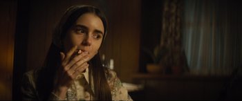 Movie still from “Extremely Wicked, Shockingly Evil and Vile” (2019), directed by Joe Berlinger – A woman is smoking a cigarette in the dark; Close Up shot, Over the shoulder angle