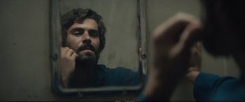 Movie still from “Extremely Wicked, Shockingly Evil and Vile” (2019), directed by Joe Berlinger – A man looking at himself in the mirror; Close Up shot, Over the shoulder angle