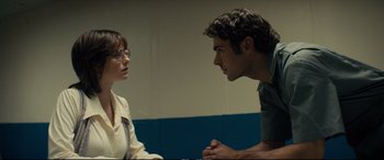 Movie still from “Extremely Wicked, Shockingly Evil and Vile” (2019), directed by Joe Berlinger – A man and a woman talking to each other; Medium shot, Over the shoulder angle
