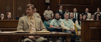 Movie still from “Extremely Wicked, Shockingly Evil and Vile” (2019), directed by Joe Berlinger – A group of people sitting in a court room; Medium shot, Over the shoulder angle
