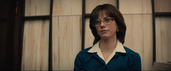 Movie still from “Extremely Wicked, Shockingly Evil and Vile” (2019), directed by Joe Berlinger – A woman wearing glasses and a blue shirt; Close Up shot, Low angle