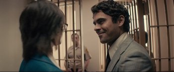 Movie still from “Extremely Wicked, Shockingly Evil and Vile” (2019), directed by Joe Berlinger – A man and a woman standing in front of a jail cell; Close Up shot, Over the shoulder angle