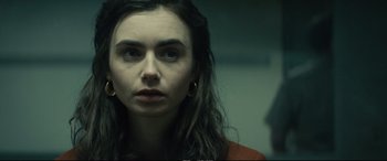Movie still from “Extremely Wicked, Shockingly Evil and Vile” (2019), directed by Joe Berlinger – A person with long dark hair; Close Up shot, Over the shoulder angle