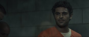 Movie still from “Extremely Wicked, Shockingly Evil and Vile” (2019), directed by Joe Berlinger – A person wearing an orange shirt; Close Up shot, Over the shoulder angle