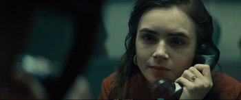 Movie still from “Extremely Wicked, Shockingly Evil and Vile” (2019), directed by Joe Berlinger – A person with a microphone; Close Up shot, Over the shoulder angle