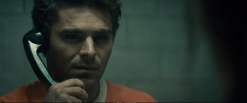 Movie still from “Extremely Wicked, Shockingly Evil and Vile” (2019), directed by Joe Berlinger – A person wearing an orange shirt; Close Up shot, Over the shoulder angle