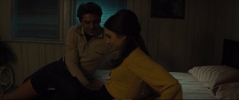 Movie still from “Extremely Wicked, Shockingly Evil and Vile” (2019), directed by Joe Berlinger – A man and a woman sitting in front of each other; Medium shot, High angle
