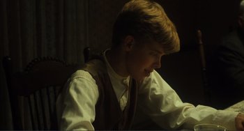 Movie still from “Matewan” (1987), directed by John Sayles – A young man sitting in front of a computer screen; Close Up shot, High angle