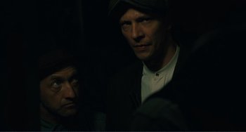 Movie still from “Matewan” (1987), directed by John Sayles – A man in a black jacket and a man in a white shirt; Close Up shot, Over the shoulder angle