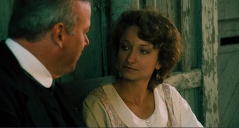 Movie still from “Matewan” (1987), directed by John Sayles – An older man and a younger woman are talking together; Close Up shot, Over the shoulder angle