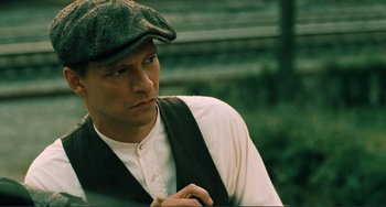 Movie still from “Matewan” (1987), directed by John Sayles – A person wearing a hat; Close Up shot, Over the shoulder angle