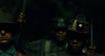Movie still from “Matewan” (1987), directed by John Sayles – A group of men in military uniforms and hats; Close Up shot, Low angle