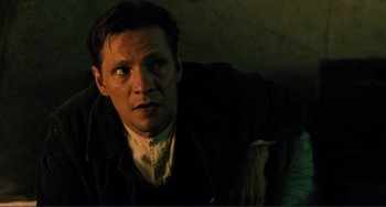 Movie still from “Matewan” (1987), directed by John Sayles – A person wearing a jacket; Close Up shot, Low angle