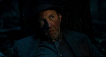 Movie still from “Matewan” (1987), directed by John Sayles – A person wearing a suit and hat; Close Up shot, Low angle