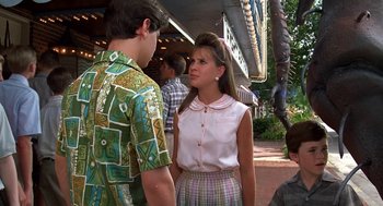 Movie still from “Matinee” (1993), directed by Joe Dante – A man and a woman talking to each other outside; Medium shot, Over the shoulder angle